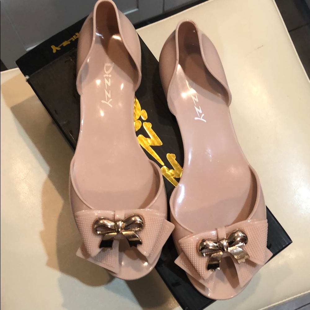Nude peep toe flats.